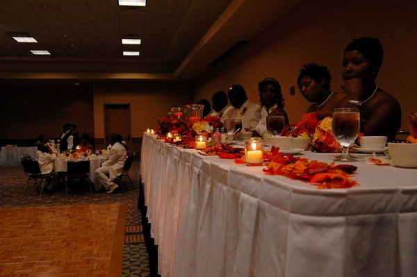 A candlelit wedding reception Candles and fall leaves adorn the traditional